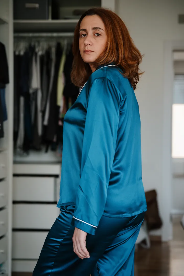 Woman in front of her open wardrobe at the start of the day